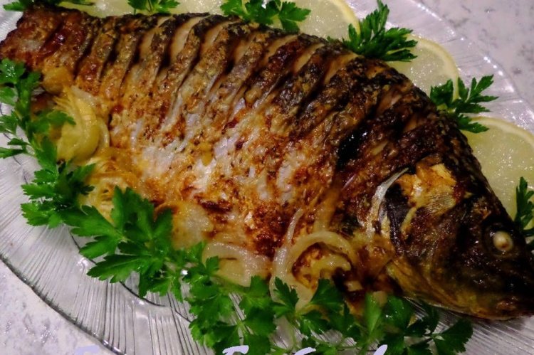 Карась с зеленью в духовке